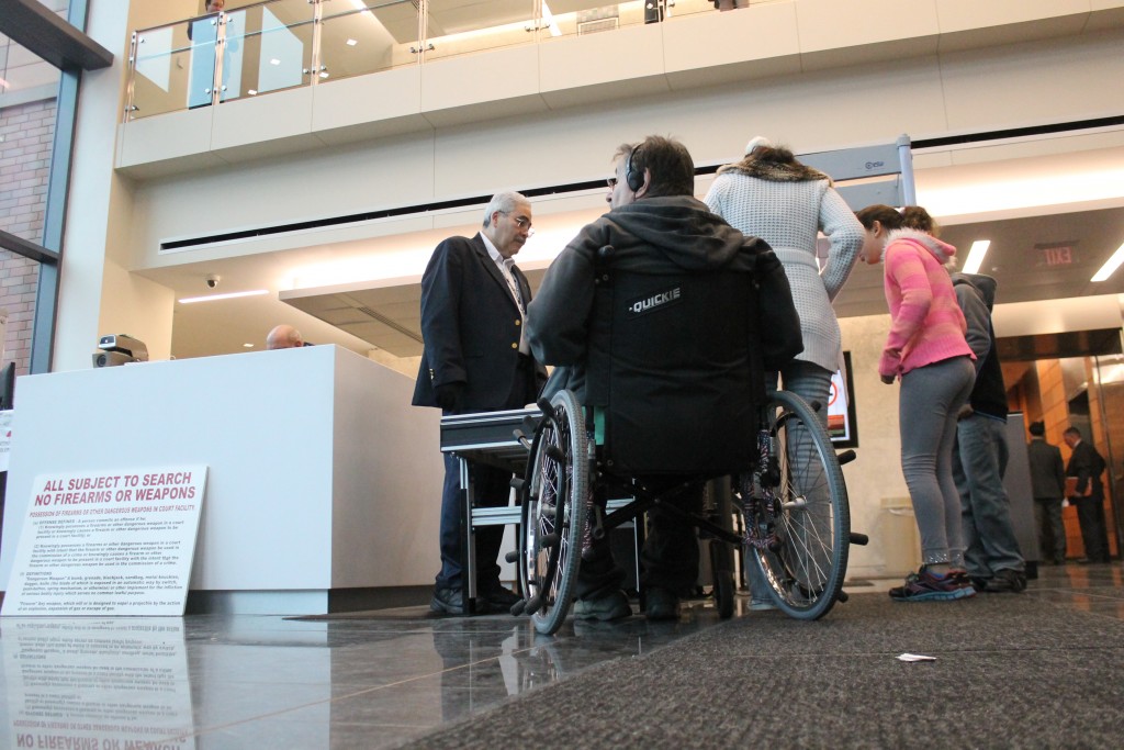 Douris waiting to go through security Monday morning. Credit: Tom Sofield/NewtownPANow.com