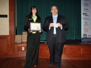 Amy McKenna after being presented an award by then-Newtown Business Association President Mick Petrucci in 2012. Credit: Tom Sofield/LevittownNow.com