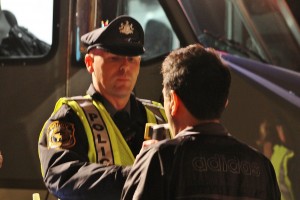 A suspected DUI driver blows into a portable breath test at a checkpoint in Newtown Township earlier this year. Credit: Tom Sofield/NewtownPANow.com