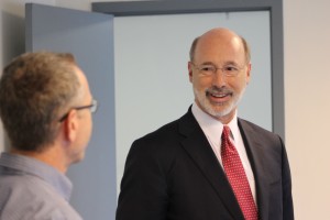 Gov. Tom Wolf speaking with a business owner in Newtown in April 2016.  Credit: Tom Sofield/NewtownPANow.com