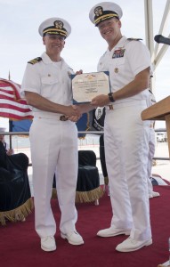 Cmdr. David S. Wells (right) receives a Meritorious Service Medal for his performance as commanding officer of Helicopter Sea Combat Squadron (HSC) 21 during a change of command ceremony held at Naval Air Station North Island. Credit: Mass Communications Specialist 2nd Class La’Cordrick Wilson/Navy