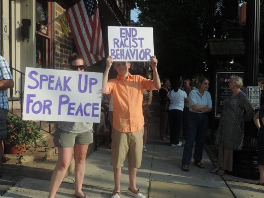 Doreen Boerner-Gage and Adam Nolan are among the more than 50 folks who attend the peace vigil in Newtown Borough. Credit: Petra Chesner Schlatter/NewtownPANow.com 