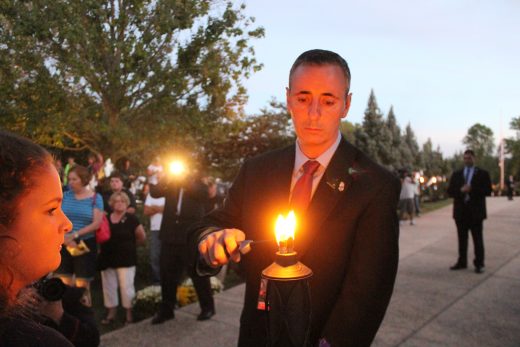 Republican Congressional candidate Brian Fitzpatrick lights a memorial flame. Credit: Tom Sofield/NewtownPANow.com 